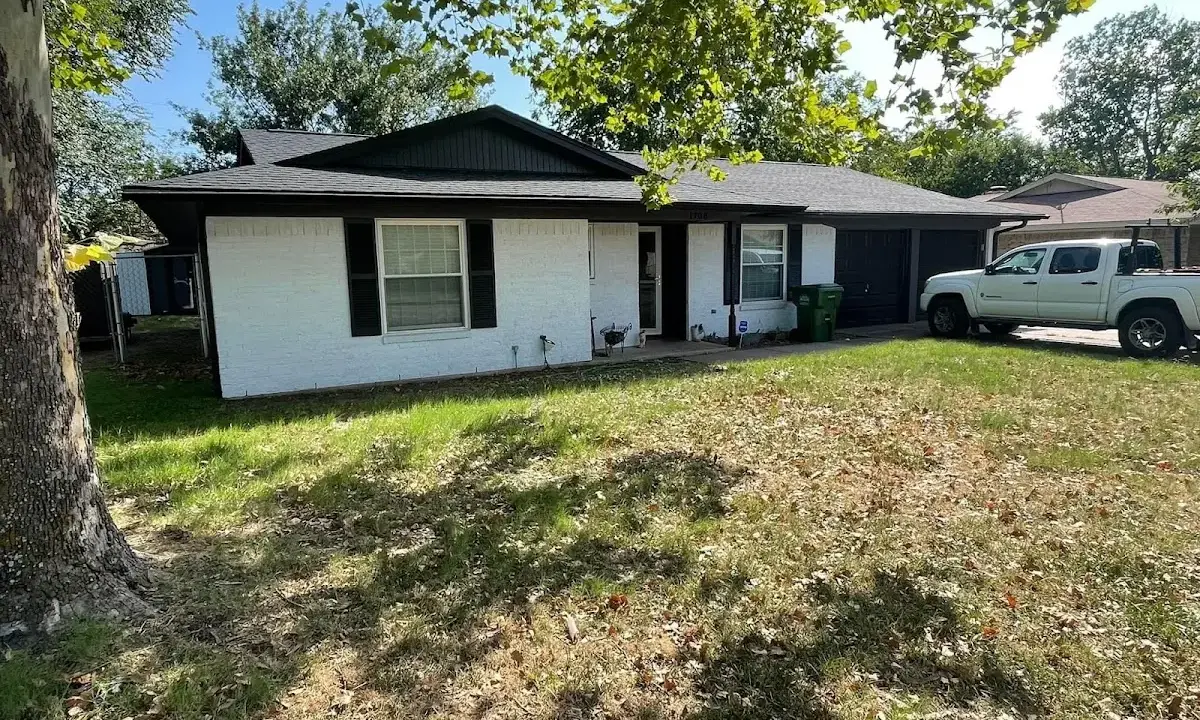 Professional roofing crew working on a residential roof in Bridge City